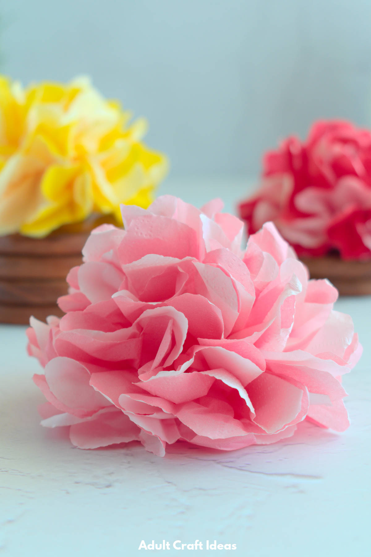 Closeup of pink paper flower.